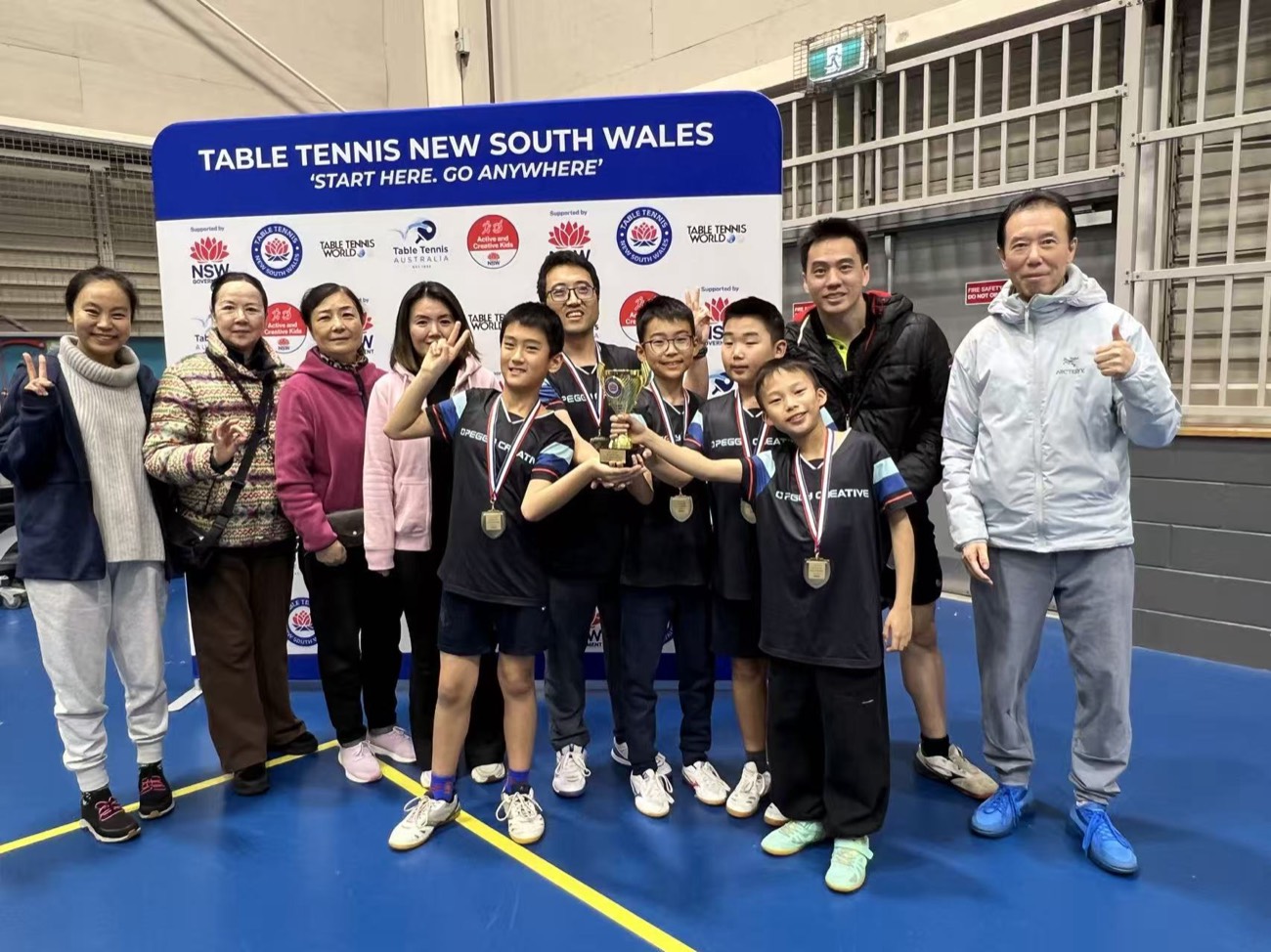 The Chatswood athletes, coaches and families celebrating together
