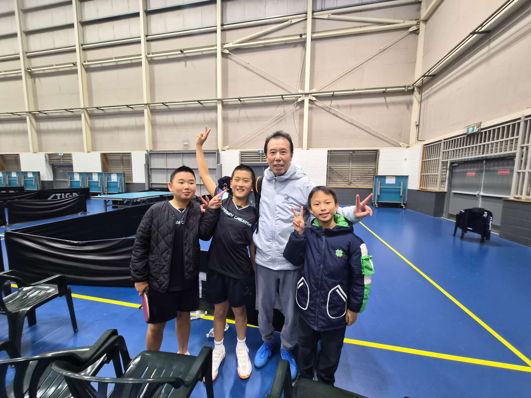 Bruce Huang, Jiahe "Jack" Huang and Lucas Dai with Coach Pei at Sydney Olympic Park.